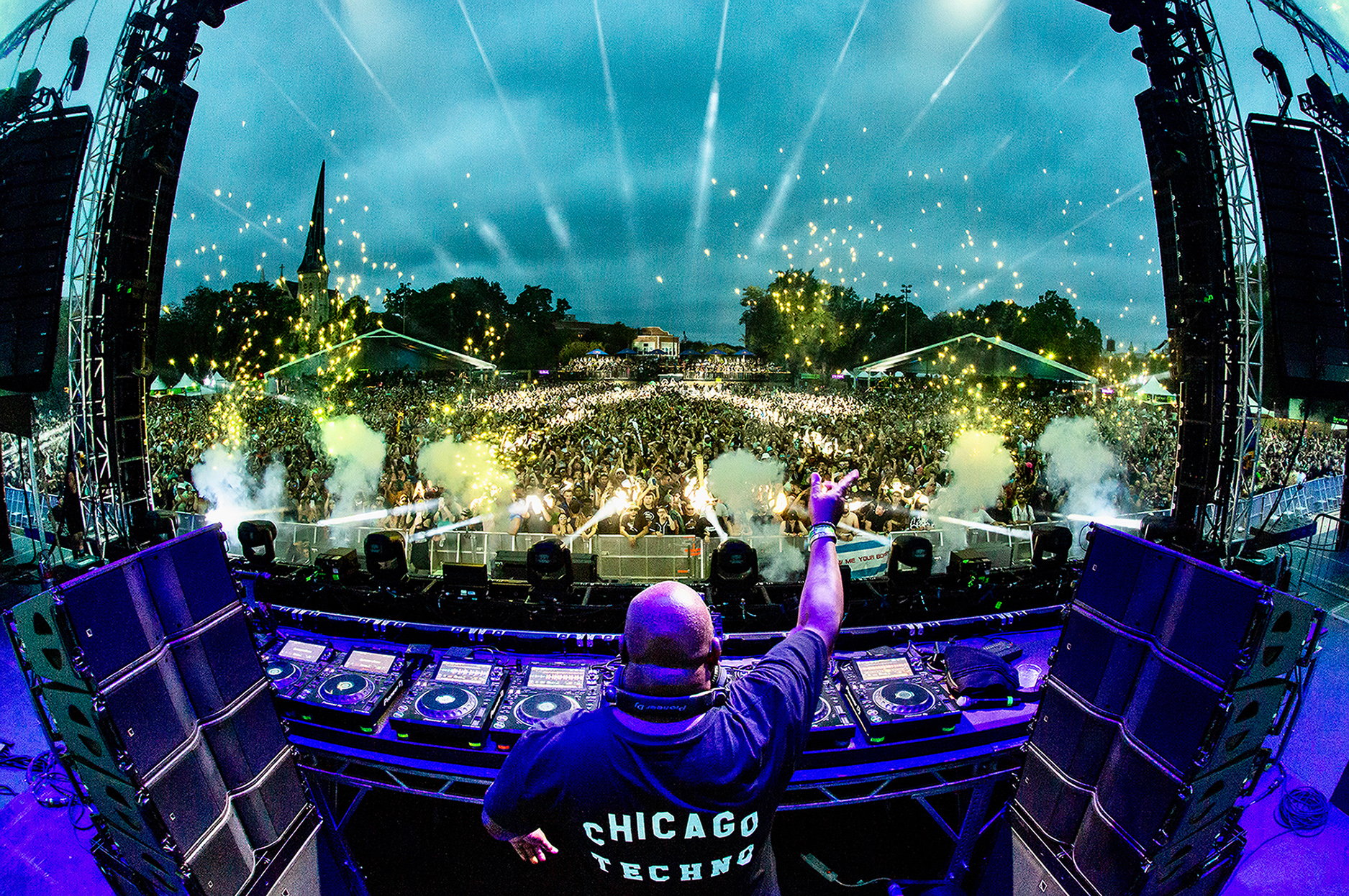 Carl Cox performing to a large outdoor crowd at arc 2022